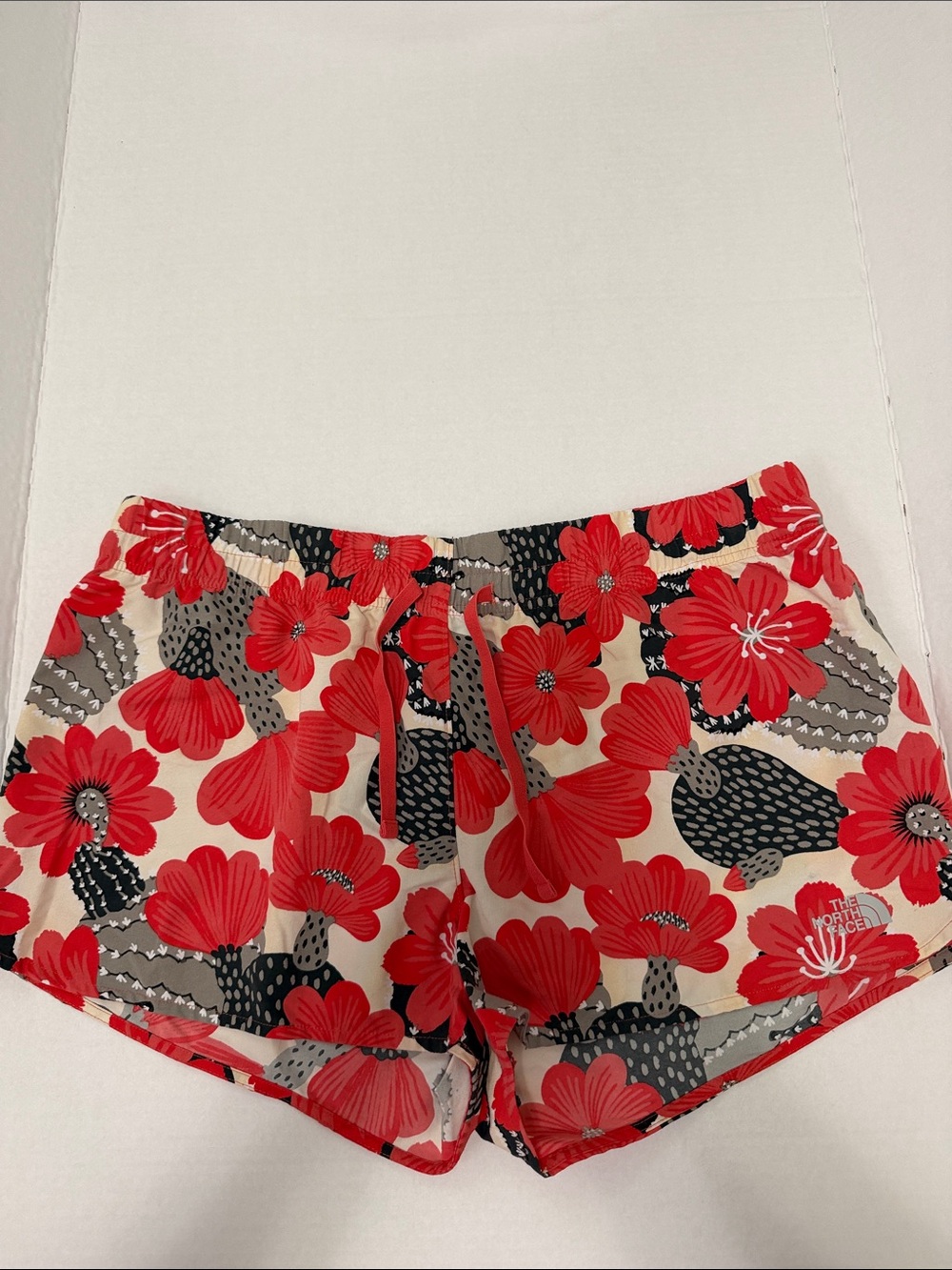 The North Face Women's Red Floral Athletic Shorts on Cream